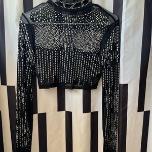 Two piece black mesh outfit with rhinestones and fringe